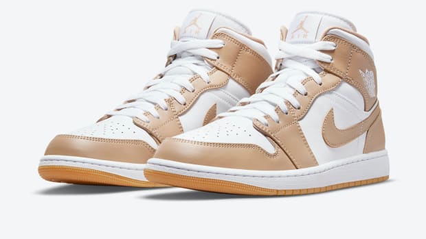 White and tan Air Jordan shoes.